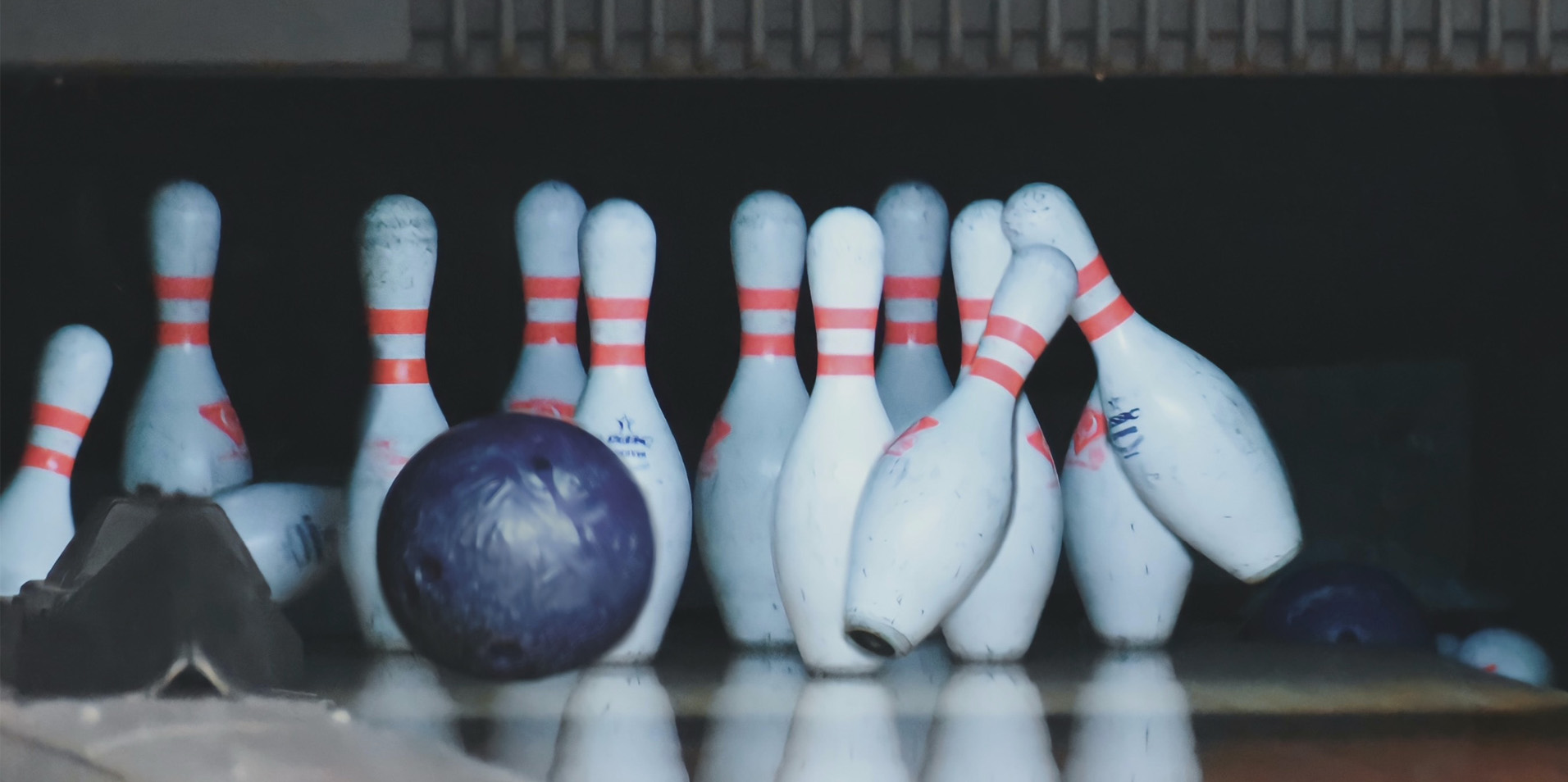 Bowling ball hitting bowling pins